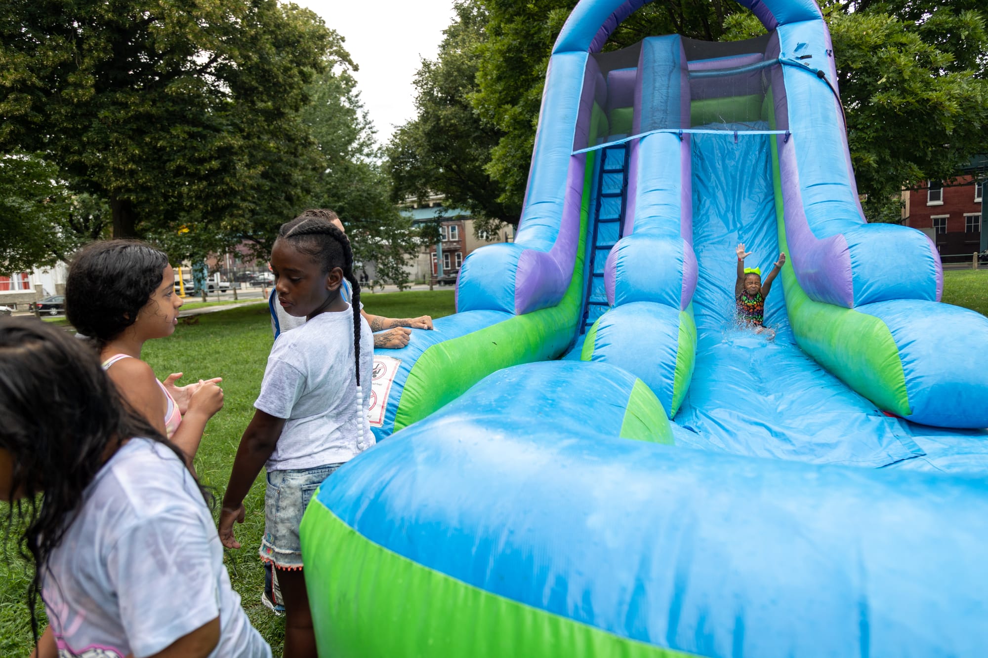 Photos of Kensington: Community members participate in the second annual "Community Water Gun Fight" in Harrowgate Park.