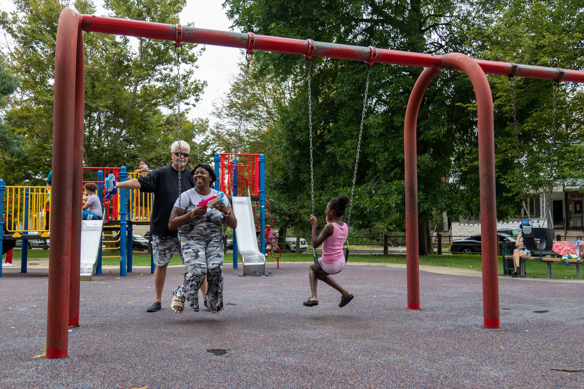 Photos of Kensington: Community members participate in the second annual "Community Water Gun Fight" in Harrowgate Park.