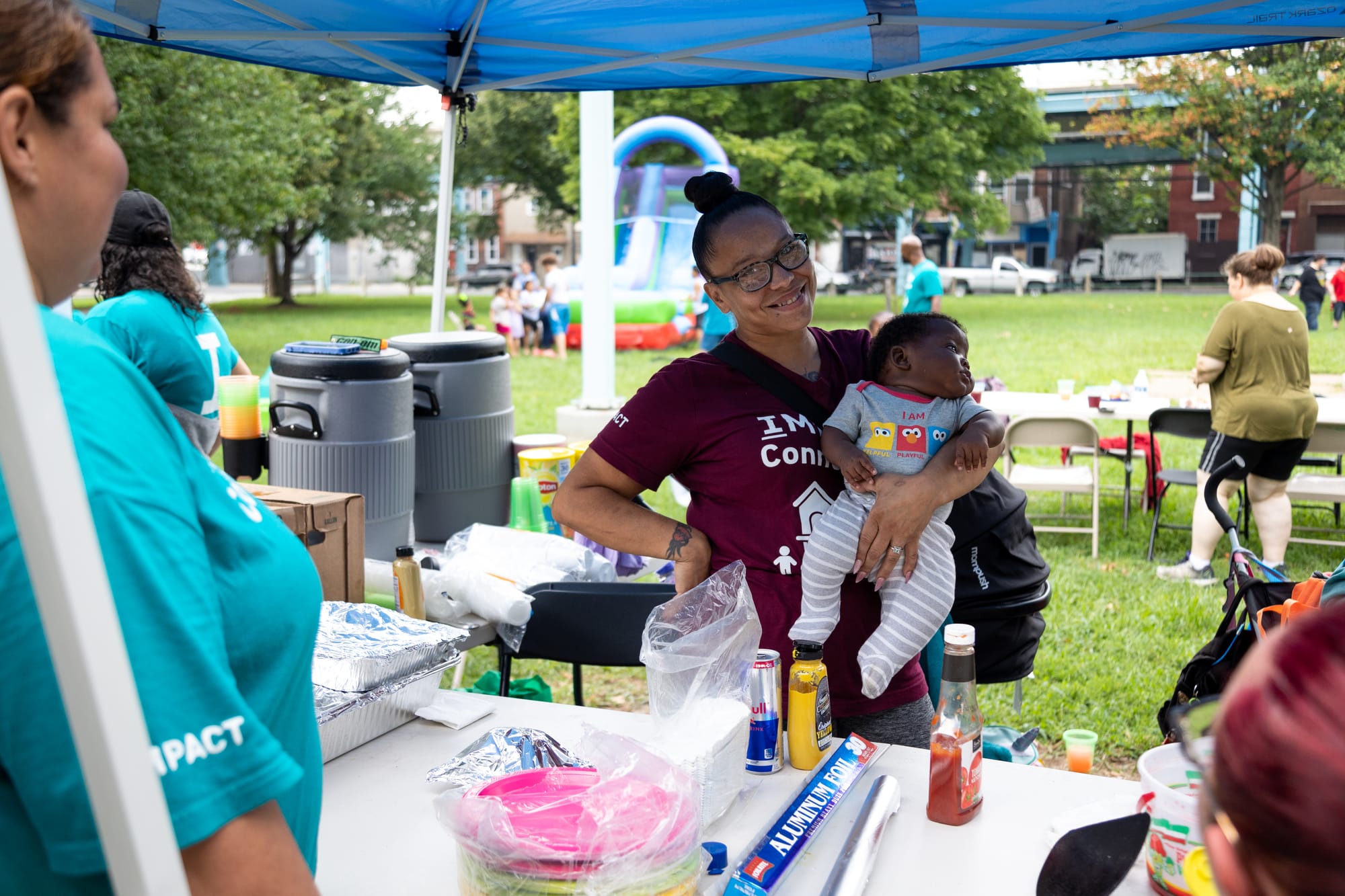 Photos of Kensington: Community members participate in the second annual "Community Water Gun Fight" in Harrowgate Park.